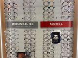many pairs of glasses on display in the store