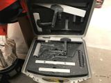 a case with a gun inside of it sitting on the floor