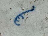a picture of a blue key on a white plate