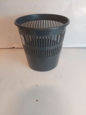 a black trash can sitting on a white counter