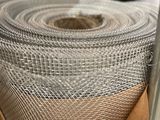 a roll of cloth that is sitting on top of a chair