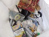a white bag filled with books and other items