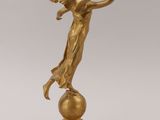 an image of a statue of a woman on a ball