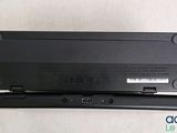 a close up of a laptop battery on a white surface