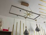 several lights hanging from the ceiling in a room