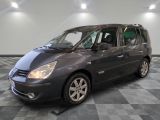 a picture of a grey minivan parked in a garage