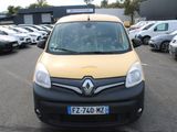 a yellow and black van parked in a parking lot