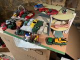 a lot of toy cars and trucks on a table