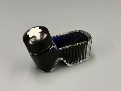 an image of a bottle of ink with a black cap