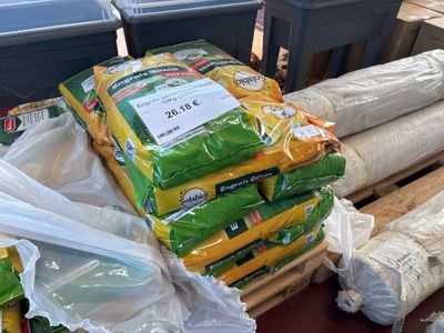 many bags of food sitting on top of a pallet