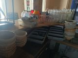 many glasses on the counter in the restaurant