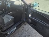 a car door open on the side of the road