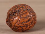 a close up picture of a wooden ball on a table
