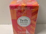 a small box of perfume sitting on a table