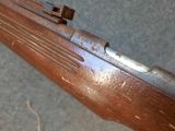 a close up of a rifle on the ground
