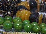 a lot of different colored beads on a table