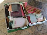 a box full of books sitting on the floor