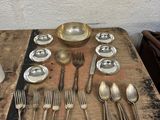a table with silverware and silverware on it