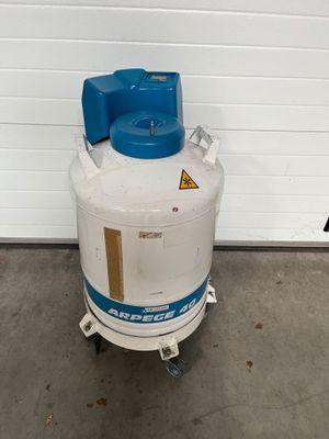 an image of a white tank with a blue cap on top of it