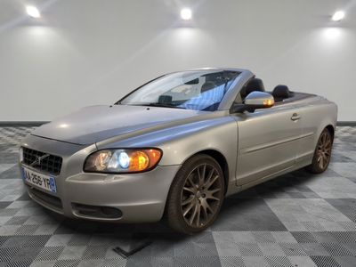 a picture of a silver car parked in a garage
