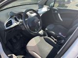 the interior of a small car with a steering wheel and dashboard