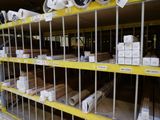many rolls of wood on the shelves in the store