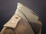 a close up of a military coat with buttons on the collar