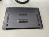 a laptop that is sitting on a table next to a pair of scissors