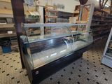 a glass display case in the middle of a store