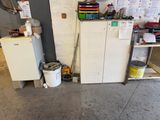 a refrigerator and a refrigerator freezer in a garage