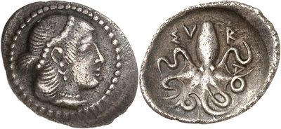 a close up of a coin with an octopus on it