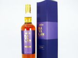the bottle of kavalan is next to a blue box