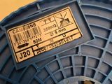 a spool of blue wire with a label on it