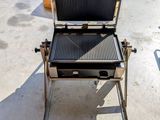 a grill that has a grill on it in the middle of the street