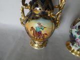 two vases sitting next to each other on a table