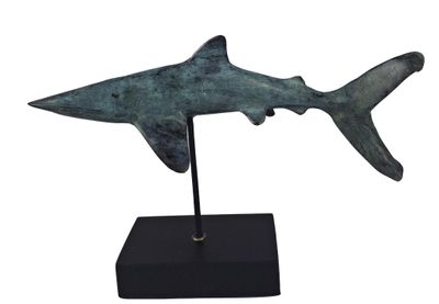 sculpture of a shark on a black stand