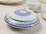 a white table topped with plates and cups and saucers