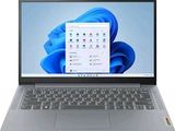 l'ordinateur portable est ouvert sur une surface blanche avec un fond bleu