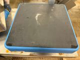 a table with a blue tray on it in the middle of a room