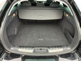 a trunk of a car with the back seats folded down