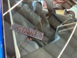 a ruler on the seat of a car that is in the back seat