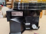 a blender sitting on top of a table next to a piece of paper