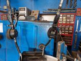 a picture of a machine that is working on a piece of metal