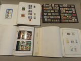 a lot of different stamps on the pages of a book