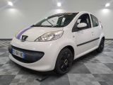 a picture of a small white car parked in a garage