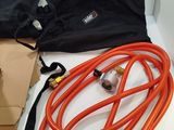 a box with a bunch of hoses and a bag