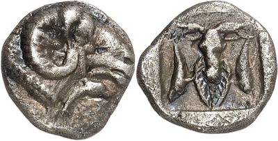 a close up of a silver coin with a bird on it