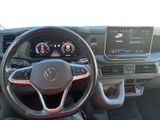 the interior of a car with a steering wheel and dashboard controls