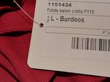 the label on the back of a red jacket with a barcode on it