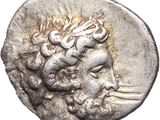 a silver coin with a head of a man on it